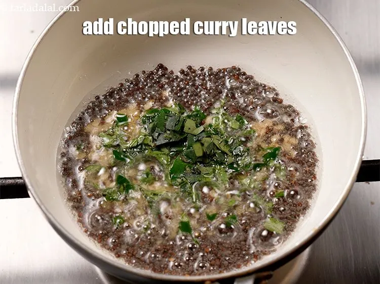 Step 15 – Add &frac12; tbsp <a href="https://www.tarladalal.com/glossary-chopped-curry-leaves-794i">chopped curry leaves (kadi patta)</a>.