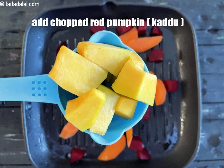 Step 15 – Add&nbsp;<meta charset="UTF-8" />1/2 cup&nbsp;<a href="glossary-red-pumpkin-kaddu-lal-bhopla-bhopla-595i">red pumpkin (bhopla / kaddu)</a>.