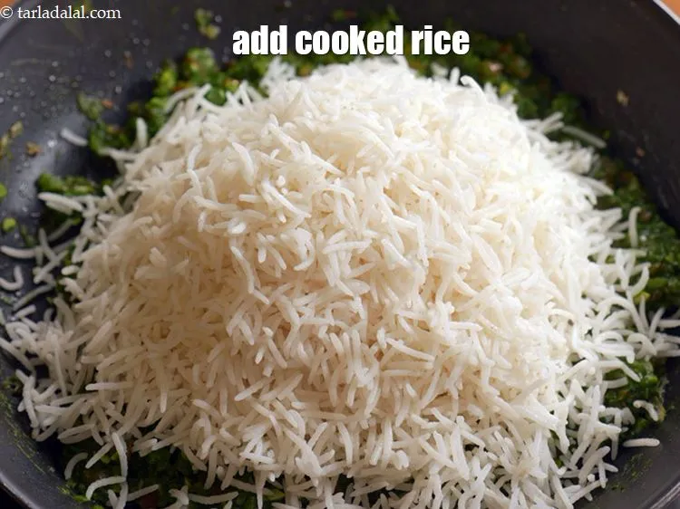 Step 14 – Add 3 cups <a href="https://www.tarladalal.com/cooked-rice-chawal-4800r">cooked rice (chawal)</a>.
