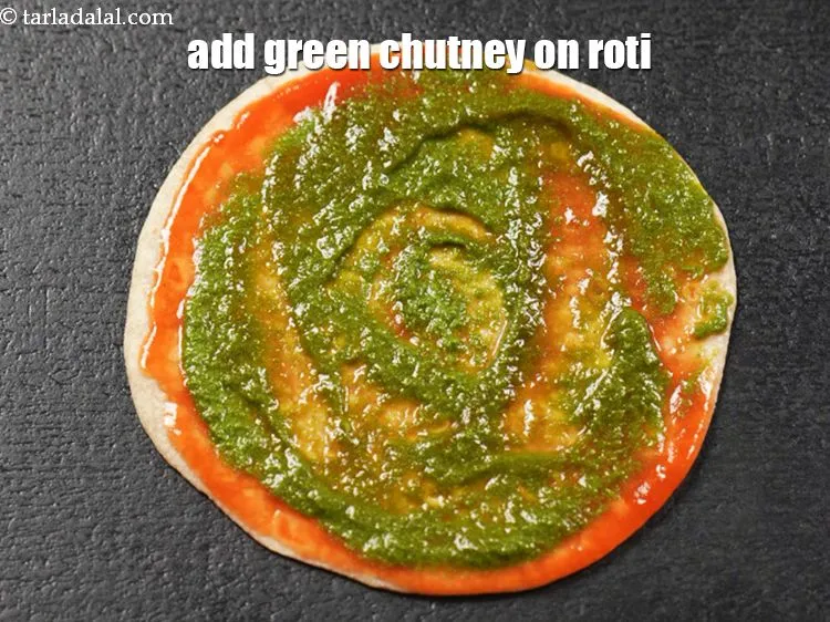 Step 14 – Add &amp;frac12; tbsp green chutney on the roti.