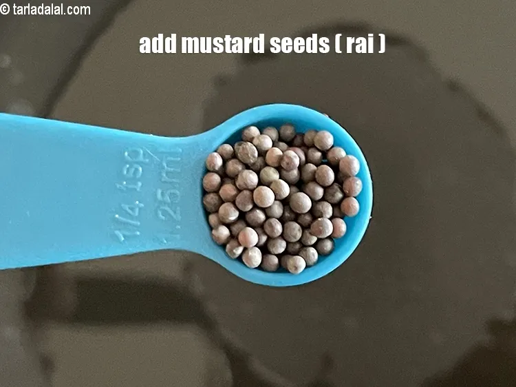 Step 14 – <p>Add 1/4 tsp <a href="https://www.tarladalal.com/glossary-mustard-seeds-sarson-rai-sarson-ke-beej-525i"><strong>mustard seeds ( rai / sarson)</strong></a><strong>.</strong></p>