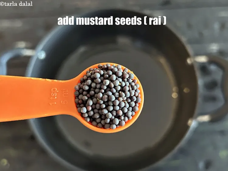 Step 15 – Add&nbsp;<meta charset="UTF-8" />1 tsp&nbsp;<a href="glossary-mustard-seeds-sarson-rai-sarson-ke-beej-525i">mustard seeds ( rai / sarson)</a>.