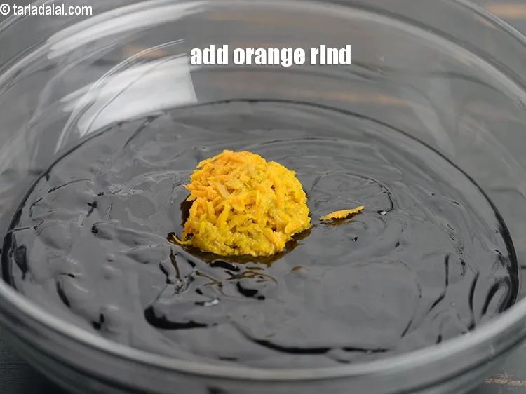 Step 14 – Add 4 tsp <a href="https://www.tarladalal.com/glossary-orange-rind-119i">orange rind</a>.