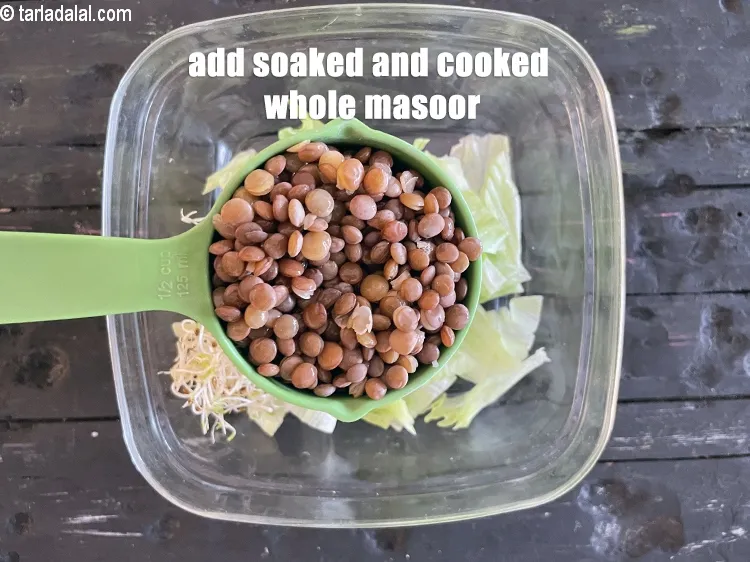 Step 26 – Add&nbsp;<meta charset="UTF-8" />1/2 cup&nbsp;<a href="glossary-boiled-masoor-2217i">soaked and cooked whole masoor (whole red lentil)</a>.