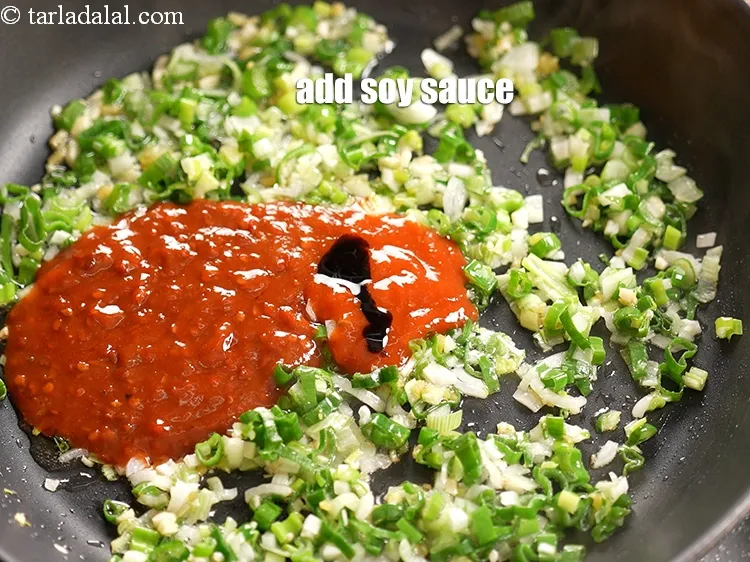 Step 14 – Add 1 tsp <a href="https://www.tarladalal.com/glossary-soy-sauce-soya-sauce-864i">soy sauce</a>.