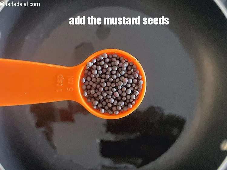 Step 16 – <meta charset="UTF-8" />Add 1 tsp&nbsp;<a href="glossary-mustard-seeds-sarson-rai-sarson-ke-beej-525i">mustard seeds ( rai / sarson)</a>.