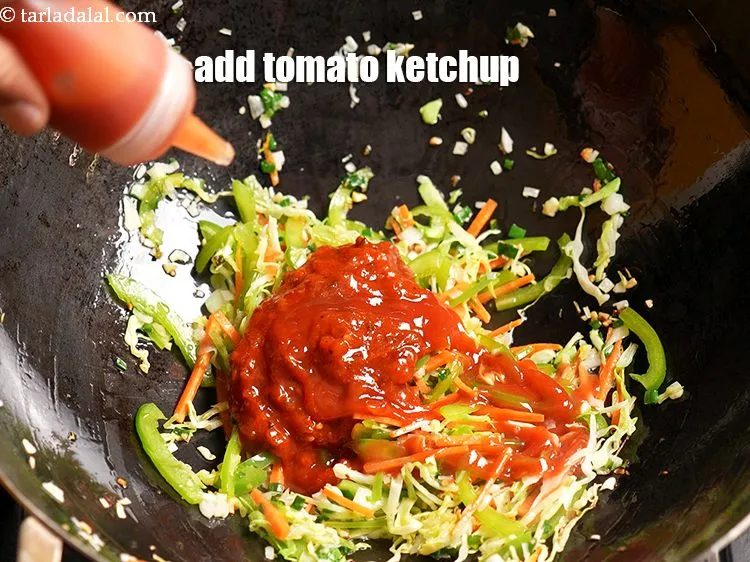 Step 14 – Add 1 tbsp <a href="https://www.tarladalal.com/glossary-tomato-ketchup-tomato-sauce-181i">tomato ketchup</a>.