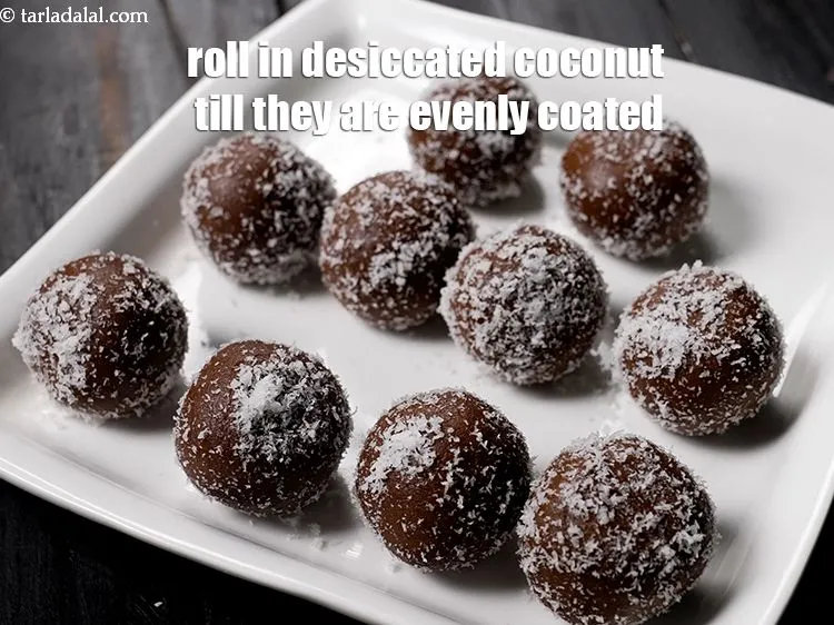 Step 14 – Roll them in desiccated coconut till they are evenly coated form all the sides.&nbsp;