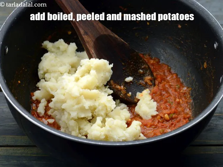Step 19 – Add 1 cup&nbsp;boiled , peeled and&nbsp;<a href="https://www.tarladalal.com/glossary-boiled-and-mashed-potatoes-1831i">mashed potatoes</a>.&nbsp;