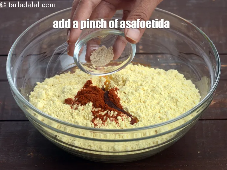 Step 16 – Add a pinch of&nbsp;<a href="https://tarladalal.com/glossary-asafoetida-hing-113i">asafoetida (hing)</a>.&nbsp;