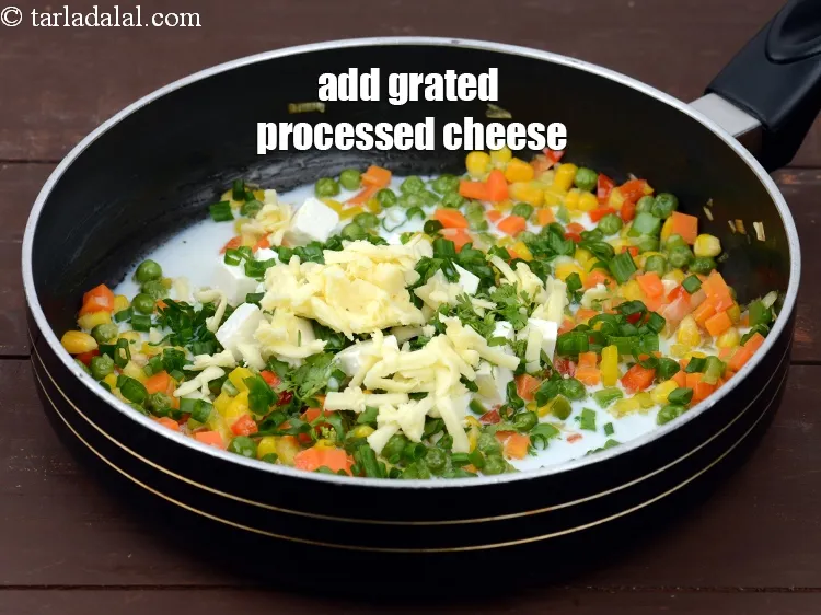 Step 13 – Add 1/4 cup&nbsp;<a href="https://tarladalal.com/glossary-grated-processed-cheese-868i">grated processed cheese</a>.&nbsp;