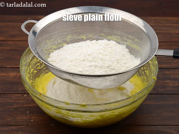 Step 15 – Sieve 2 1/4 cups&nbsp;<a href="https://www.tarladalal.com/glossary-plain-flour-maida-188i">plain flour (maida)</a>.
