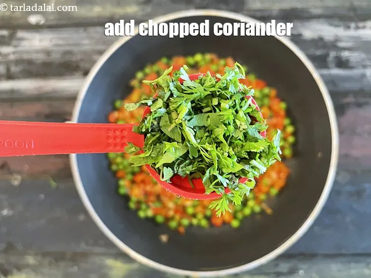 Step 19 – Add&nbsp;<meta charset="UTF-8" />2 tbsp&nbsp;finely&nbsp;<a href="glossary-chopped-coriander-783i">chopped coriander (dhania)</a>.