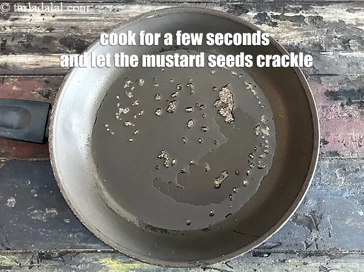 Step 14 – Cook for a few seconds and let the mustard seeds crackle.