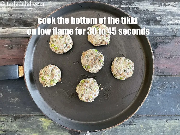 Step 26 – Cook the bottom of the tikki for 30 to 45 seconds on low flame.