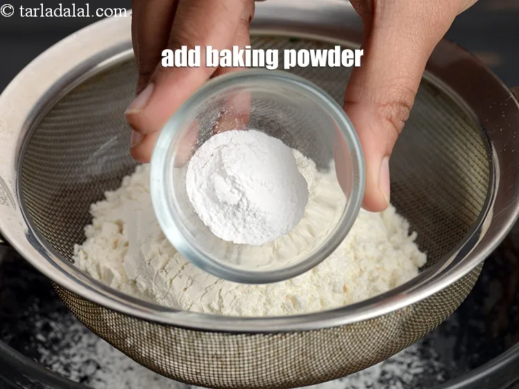 Step 14 – Add 1 tsp <a href="https://www.tarladalal.com/glossary-baking-powder-425i">baking powder</a>.