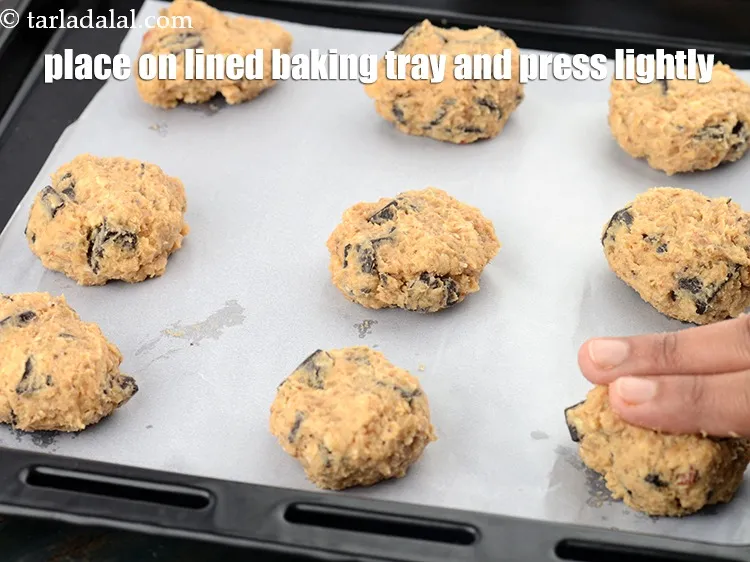 Step 14 – Place them on a lined baking tray and press each cookie lightly.&nbsp;