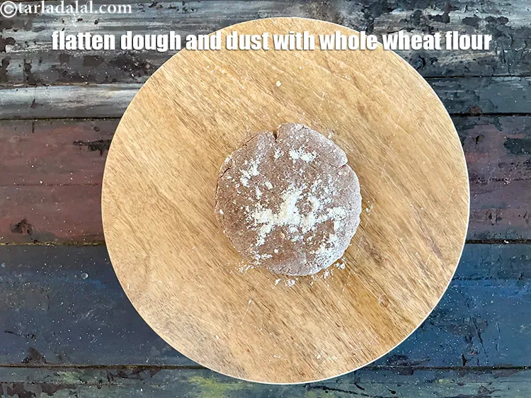 Step 14 – Fallten out one portion of the dough and dust it with whole wheat flour.