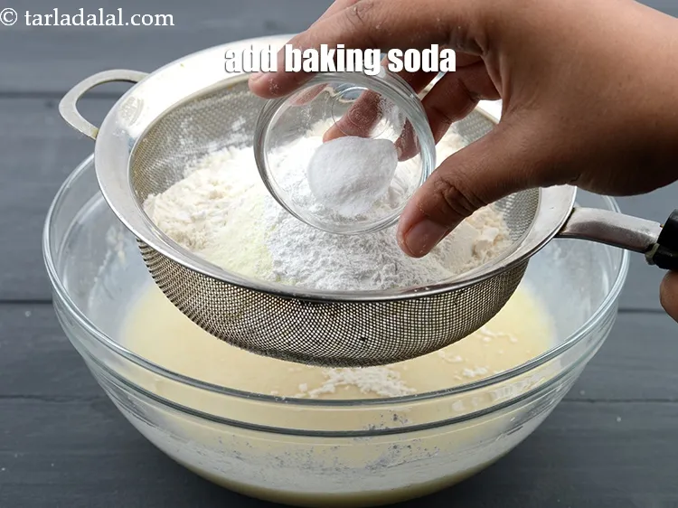 Step 14 – Add &frac12; tsp <a href="https://www.tarladalal.com/glossary-baking-soda-soda-bi-carb-615i">baking soda</a>.