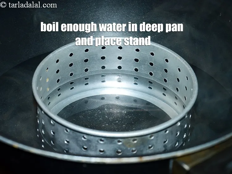 Step 14 – Boil enough water in a deep pan and place a stand at the base.