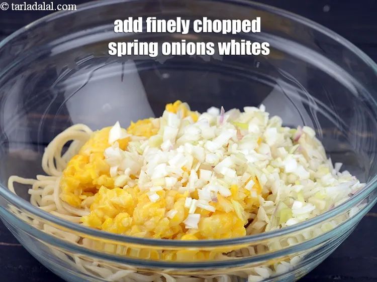 Step 15 – Add &frac14; cup finely <a href="https://www.tarladalal.com/glossary-chopped-spring-onion-whites-815i">chopped spring onions whites</a>.