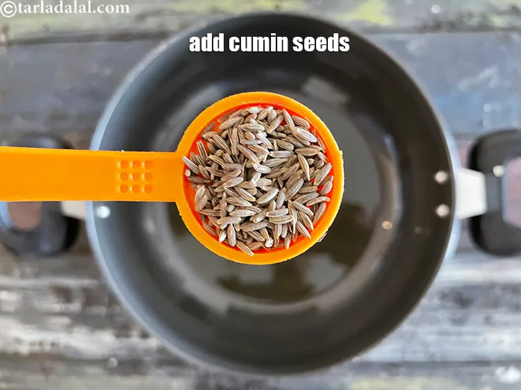 Step 26 – Add&nbsp;<meta charset="UTF-8" />1 tsp&nbsp;<a href="glossary-cumin-seeds-jeera-zeera-381i">cumin seeds (jeera)</a>.