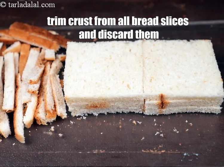 Step 15 – Trim the crust from all the <a href="https://www.tarladalal.com/glossary-bread-219i">bread</a>&nbsp;slices and discard them.