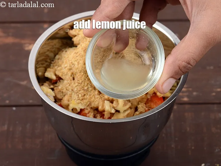Step 14 – Add 1 tsp <a href="https://www.tarladalal.com/glossary-lemon-juice-numbi-ka-ras-nimbu-ka-juice-471i">lemon juice</a>.