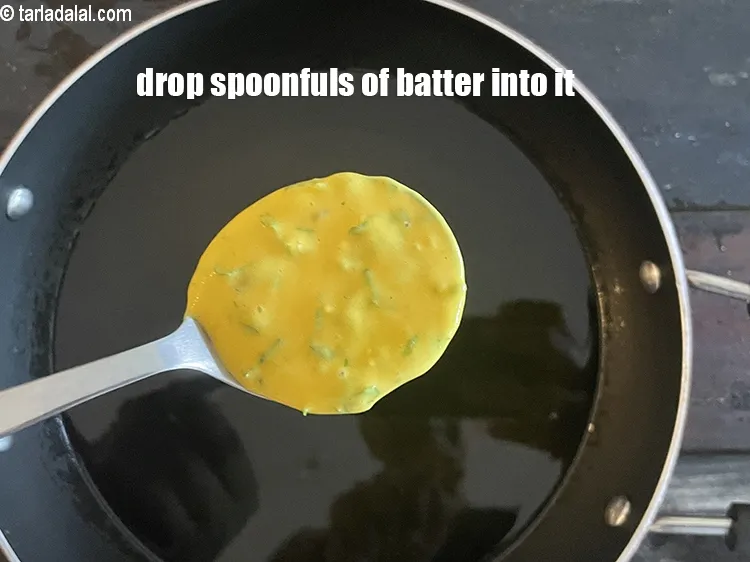 Step 14 – Drop spoonfuls of the batter into it&nbsp;