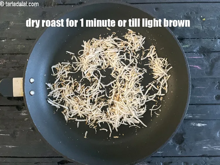 Step 14 – Dry roast on a medium flame for 1 minute or till the coconut turns light …