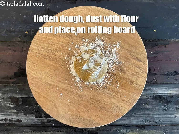 Step 16 – <meta charset="UTF-8" />Flatten one portion in between your palms and place on rolling board. Dust …