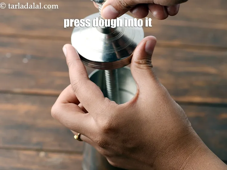 Step 14 – Press the dough into it.