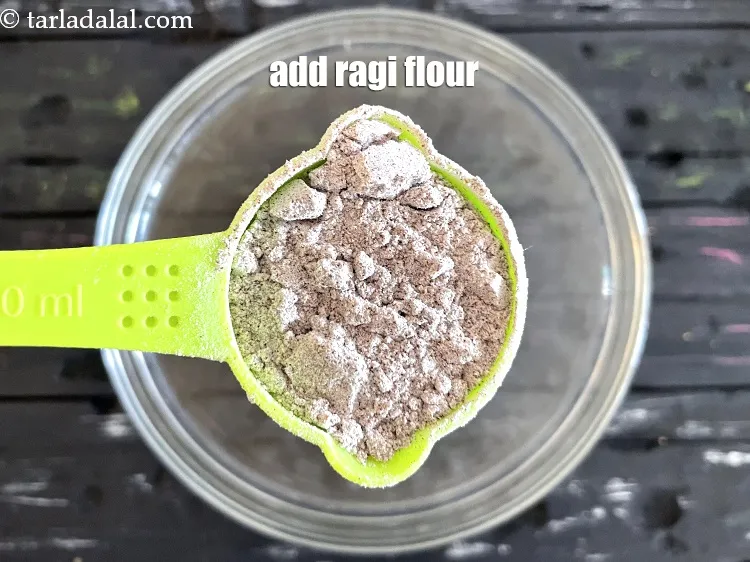 Step 23 – Add&nbsp;<meta charset="UTF-8" />1/4 cup&nbsp;<a href="glossary-ragi-flour-nachni-flour-nachni-ka-atta-red-millet-flour-1115i">ragi flour</a>.