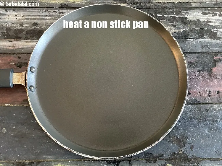 Step 15 – Heat a non-stick tava (griddle).