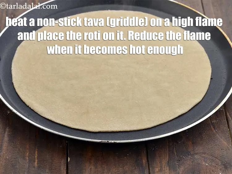 Step 20 – Heat a non-stick tava (griddle) on a high flame and place the roti on it. …
