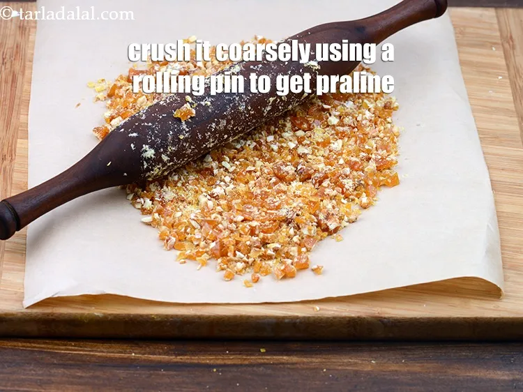 Step 14 – Crush it coarsely using a rolling pin. The praline for butterscotch ice cream is ready.&nbsp;