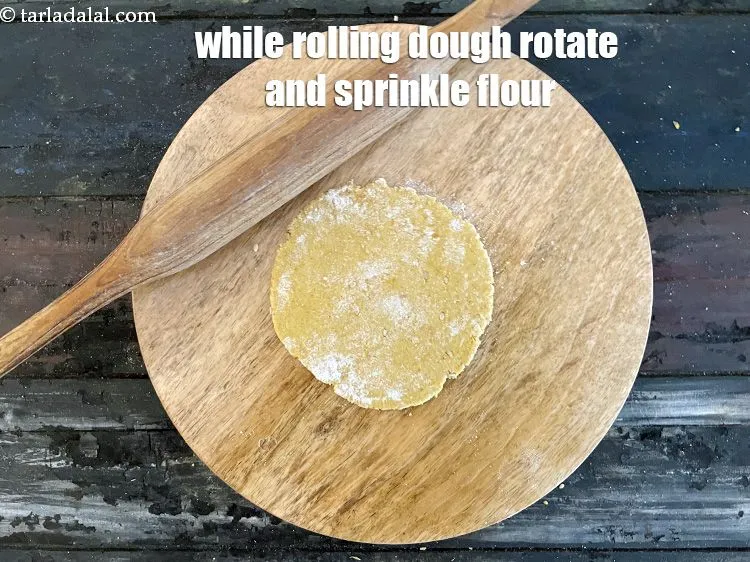 Step 18 – As you roll the dough, you will need to rotate it and sprinkle whole wheat …