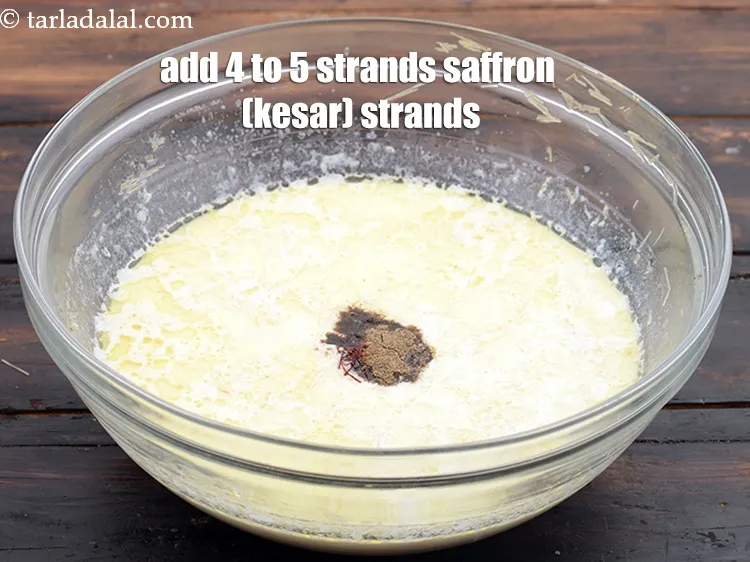 Step 14 – Add 4&nbsp;to 5&nbsp;strands&nbsp;<a href="https://www.tarladalal.com/glossary-saffron-kesar-520i">saffron (kesar) strands</a>.
