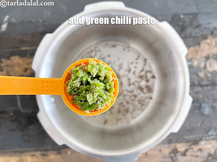 Step 22 – Add 2&nbsp;tsp&nbsp;<a href="https://www.tarladalal.com/glossary-green-chilli-paste-hari-mirch-ki-paste-mirchi-paste-333i">green chilli paste</a>.