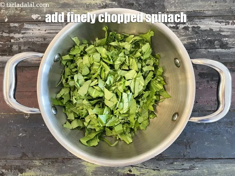 Step 14 – Add&nbsp;<meta charset="UTF-8" />3 cups&nbsp;finely&nbsp;<a href="glossary-chopped-spinach-780i">chopped spinach (palak)</a>.
