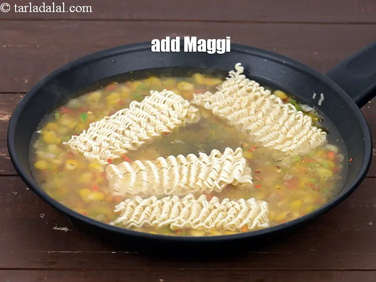 Step 14 – Add 1 packet&nbsp;<a href="https://tarladalal.com/glossary-maggi-noodles-1362i">maggi noodles</a>.&nbsp;