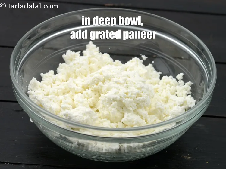 Step 16 – To make stuffing, in a deep bowl, add 1&frac14; cups grated&nbsp;<a href="https://www.tarladalal.com/glossary-paneer-cottage-cheese-chenna-985i">paneer (cottage cheese)</a>