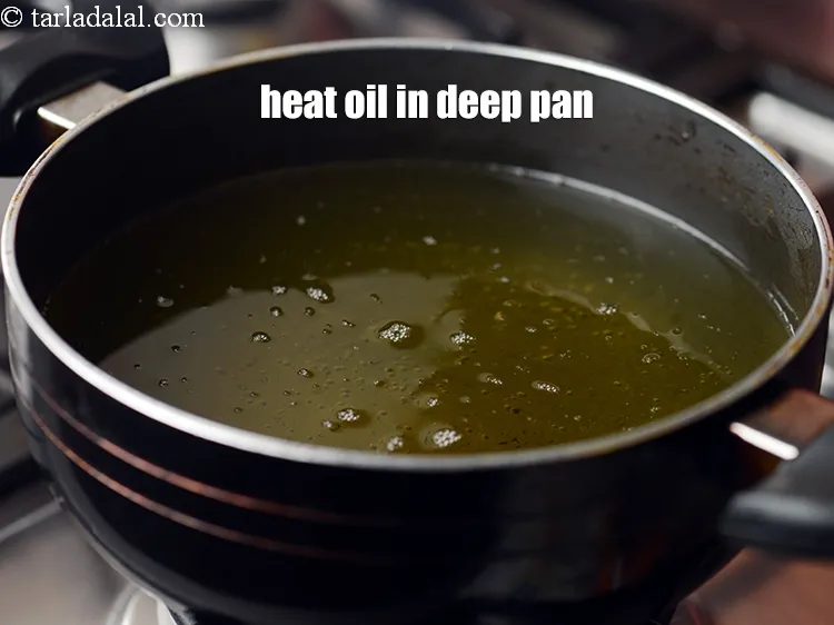 Step 17 – To make <strong>peanut pakoda recipe |&nbsp;shingdana bhajiya | peanut pakora |&nbsp;peanut fritters |</strong>&nbsp; heat the …