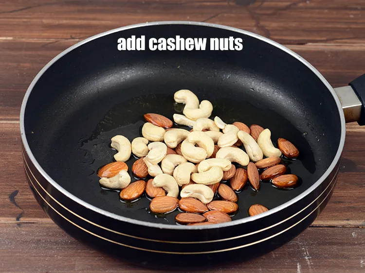 Step 14 – Add &frac14; cup <a href="https://www.tarladalal.com/glossary-cashew-nuts-kaju-840i">cashew nuts (kaju)</a>.