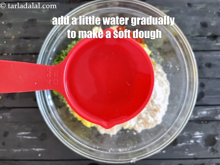 Step 15 – Add a little water gradually&nbsp;to make a soft dough. We used a 1/4 cup water.
