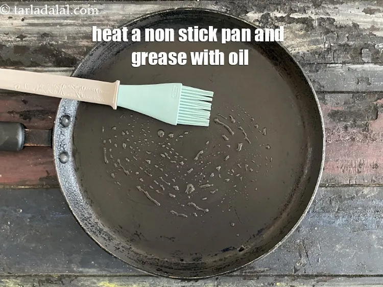 Step 17 – Heat a non-stick tava (griddle) and grease with oil.