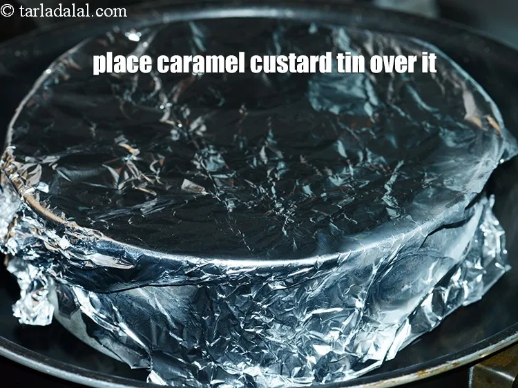 Step 14 – Place the caramel custard tin over it.