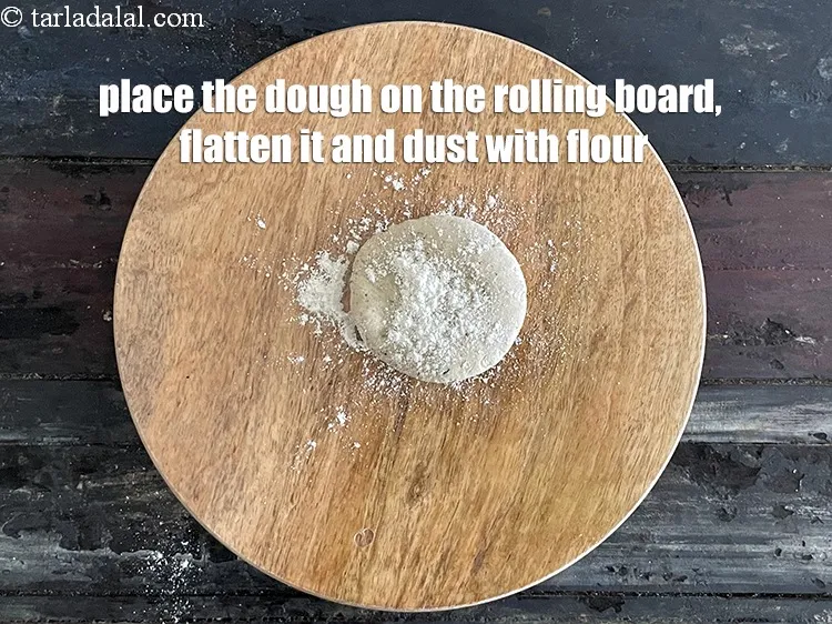 Step 15 – <meta charset="UTF-8" />Place a portion of the dough on it and flatten it.&nbsp;&nbsp;