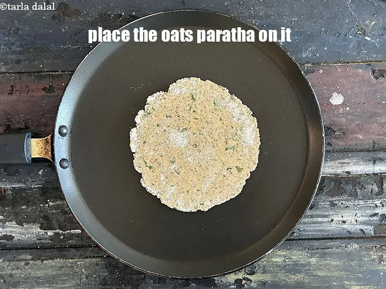 Step 15 – Place the&nbsp;<strong>Oats paratha</strong>&nbsp;on it.
