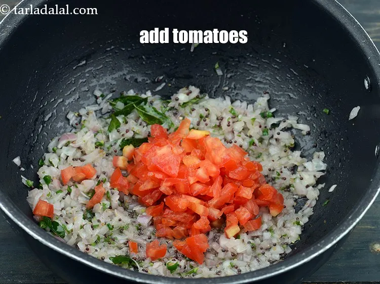 Step 14 – Add 1/2 cup&nbsp;finely&nbsp;<a href="https://www.tarladalal.com/glossary-chopped-tomatoes-779i">chopped tomatoes</a>.&nbsp;